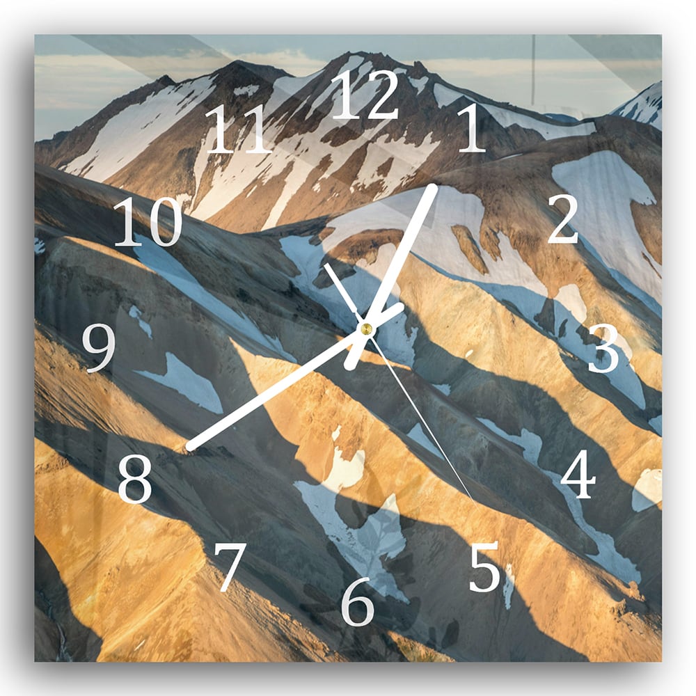 Wanduhr 30x30 - Schmelzender Schnee auf den Bergen