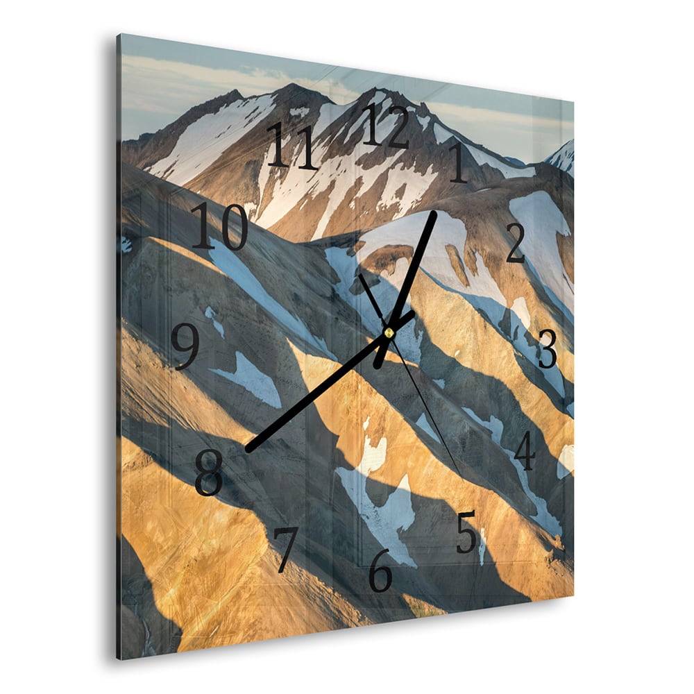 Wanduhr 30x30 - Schmelzender Schnee auf den Bergen
