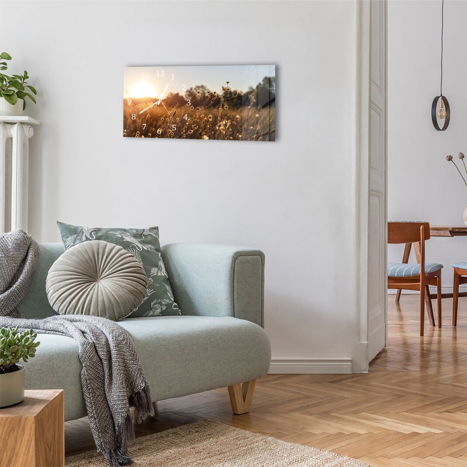Wanduhr 60x30 - Sonnenuntergang auf der Wiese