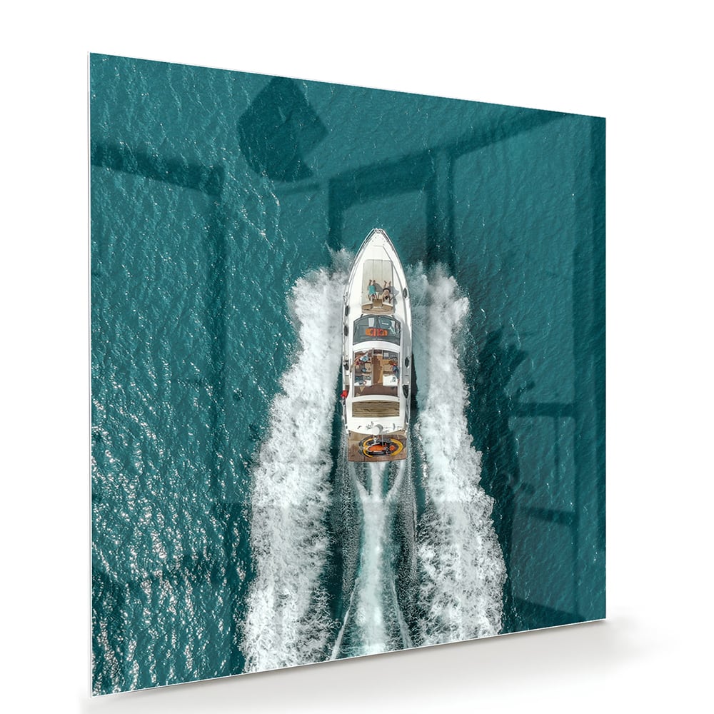 Glasbild mit einem Boot in türkisfarbenem Wasser – Glasbild aus Sicherheitsglas, Größe 100x70
