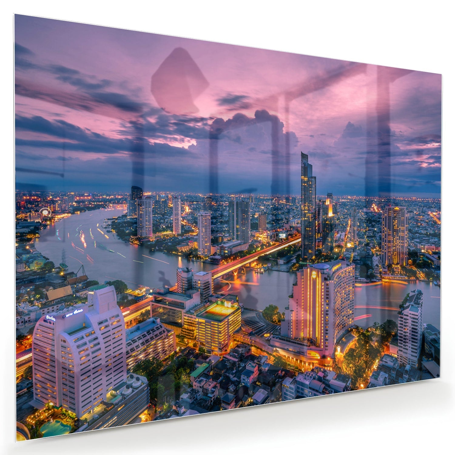 Glasbild mit Stadtblick im Abendlicht