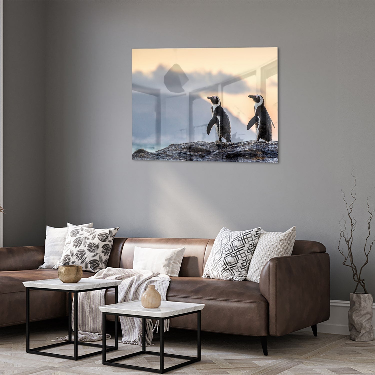 Glasbild mit Pinguinen bei Sonnenuntergang