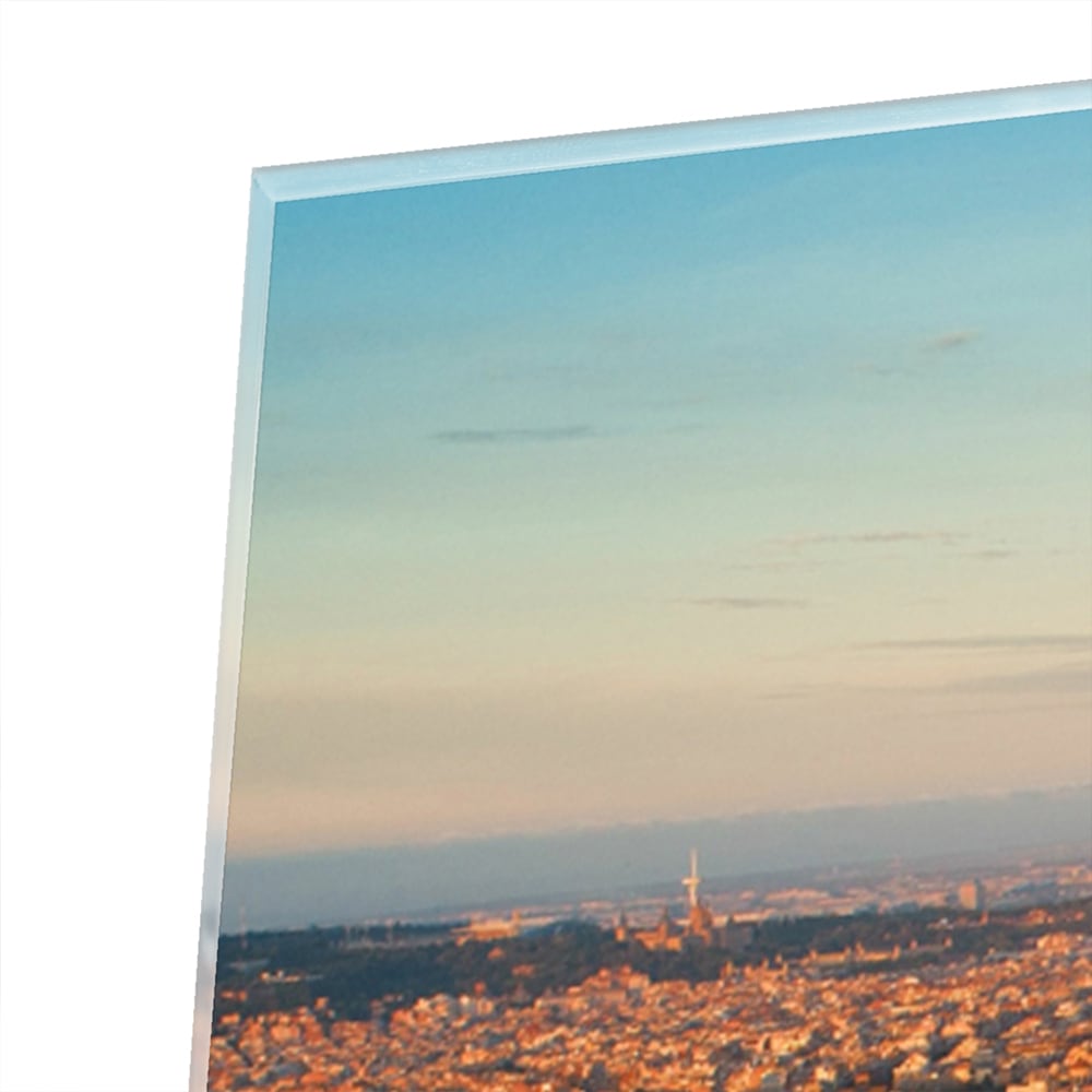 Glasbild mit atemberaubendem Stadtblick bei Sonnenuntergang
