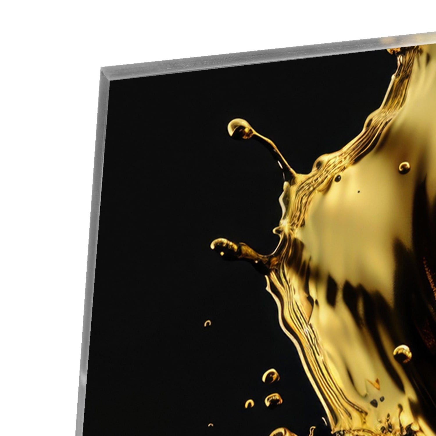 Glasbild mit Spritzern auf schwarzer Fläche