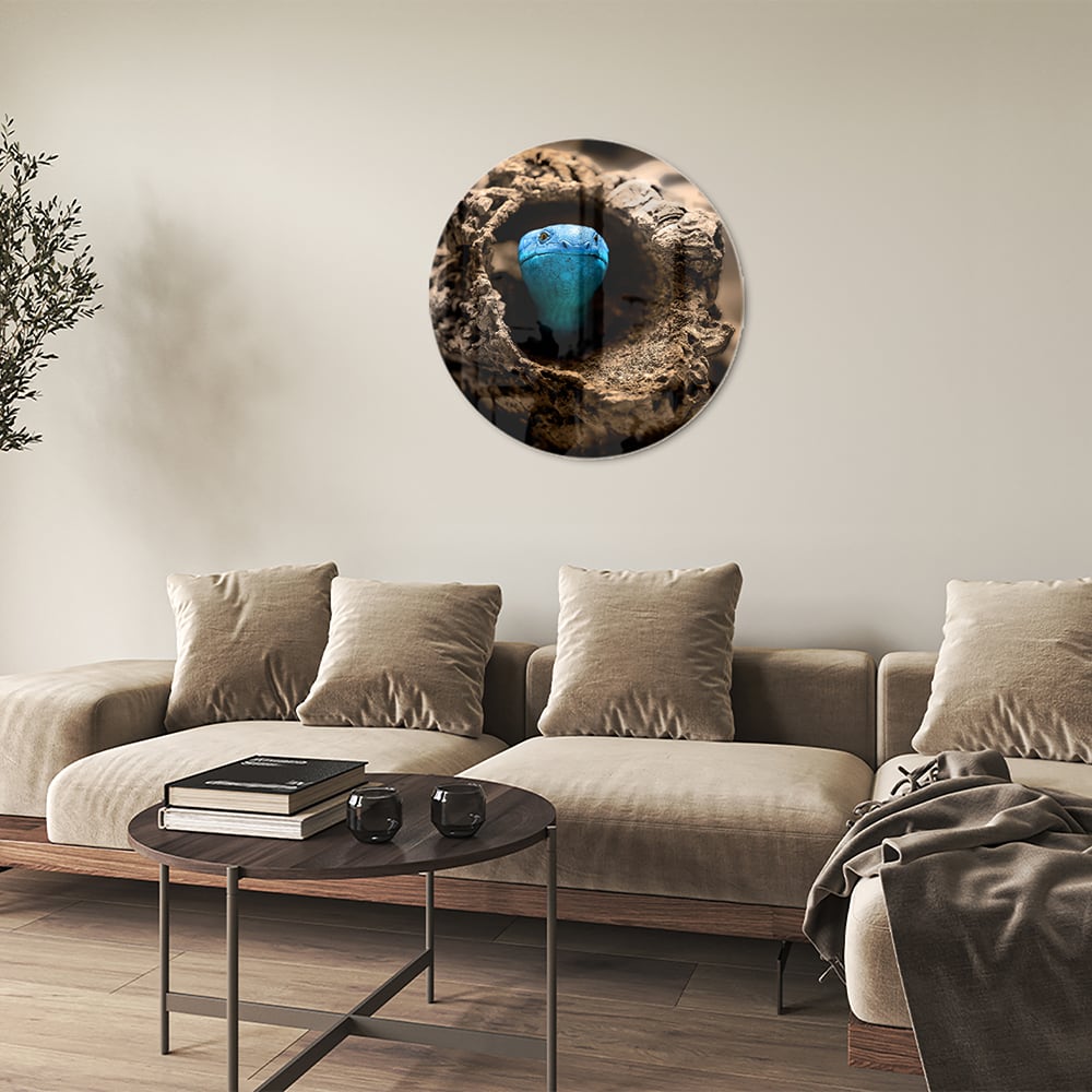 Glasbild mit einer blauen Perle in einem Nest